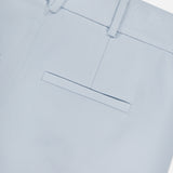 Close-up of the Craig High Rise Short by VERONICA BEARD in light blue Italian cotton-blend twill, featuring a waistband with belt loops and a single welt back pocket, shown on a white background.