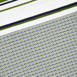The Dawna Knit Midi Dress by VERONICA BEARD features a geometric, repetitive variegated stripe design in navy blue, green, and white with zigzag patterns and bold horizontal stripes at the top.