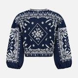 The Drake Embroidered Balloon Sleeve Jacket by VERONICA BEARD is a navy blouse with white floral and geometric embroidery on the back and sleeves, featuring a boxy fit and elastic cuffs—perfect for making a statement on any occasion.