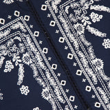 Close-up of the VERONICA BEARD Drake Embroidered Balloon Sleeve Jacket in navy, showcasing intricate white floral and geometric embroidery with a visible brand label.
