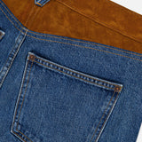 Close-up of the Dylan High Rise Straight Leg Jean by VERONICA BEARD, crafted in the USA with a brown suede yoke, a single back pocket, detailed stitching, and contrasting suede panels.
