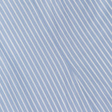Close-up of the Florenz Striped Shift Dress by VERONICA BEARD showing light blue fabric with thin white diagonal stripes and a visible center seam, ideal for summer wear or as a chic cotton mini dress.