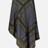The Hartley Scarf Print Skirt by VERONICA BEARD is a silk midi skirt with a handkerchief-hem silhouette, featuring geometric and floral patterns in navy, green, and white. Asymmetric points and intricate border detailing complete this striking design.