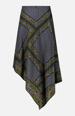 The Hartley Scarf Print Skirt by VERONICA BEARD is a silk midi skirt with a handkerchief-hem silhouette, featuring geometric and floral patterns in navy, green, and white. Asymmetric points and intricate border detailing complete this striking design.