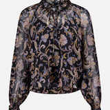 The VERONICA BEARD Silk Hickory Blouse is a sheer black paisley top with gold, blue, and beige floral accents, long sleeves, ruffled high neck with tie, and elastic cuffs for a chic bohemian style.