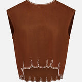 The Kessan Embroidered Linen Top by VERONICA BEARD features a sleeveless, brown design with white scalloped edges, decorative loops, and a straight neckline. Its lightweight, slightly sheer linen is perfect for warm days.