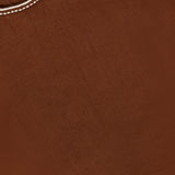 Close-up of the Kessan Embroidered Linen Top by VERONICA BEARD, featuring brown fabric with white stitching detail along the neckline and a small visible clothing tag.