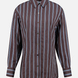 The Lloyd Striped Button Down Shirt by VERONICA BEARD is a relaxed fit brown shirt with vertical blue and white stripes, collar, cuffed sleeves, and a long buttoned front, shown against a plain white background.