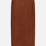 The Malou Embroidered Midi Skirt by VERONICA BEARD is a brown linen skirt with a scalloped hem and white embroidery, featuring an elegant, minimalist design without visible fastenings or patterns.