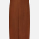 The Malou Embroidered Midi Skirt by VERONICA BEARD is a brown linen midi with a straight silhouette, back zipper, and scalloped hemline accented by delicate white embroidery. The fabric looks smooth and lightweight.