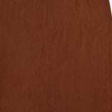 Close-up of the VERONICA BEARD Malou Embroidered Midi Skirt, showcasing brown linen fabric with a center vertical seam, concealed waist zipper, and a small bottom hem slit.