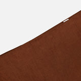 A close-up of the VERONICA BEARD Malou Embroidered Midi Skirt in brown linen with a diagonal edge and a small white label near the top right corner, set against a plain white background.