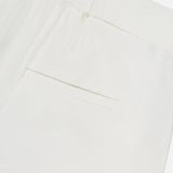 Close-up of the Marbeau Wide Leg Pant by VERONICA BEARD, showing the off-white high-rise design with an elastic waistband, single welt pocket, and lightweight textured fabric.