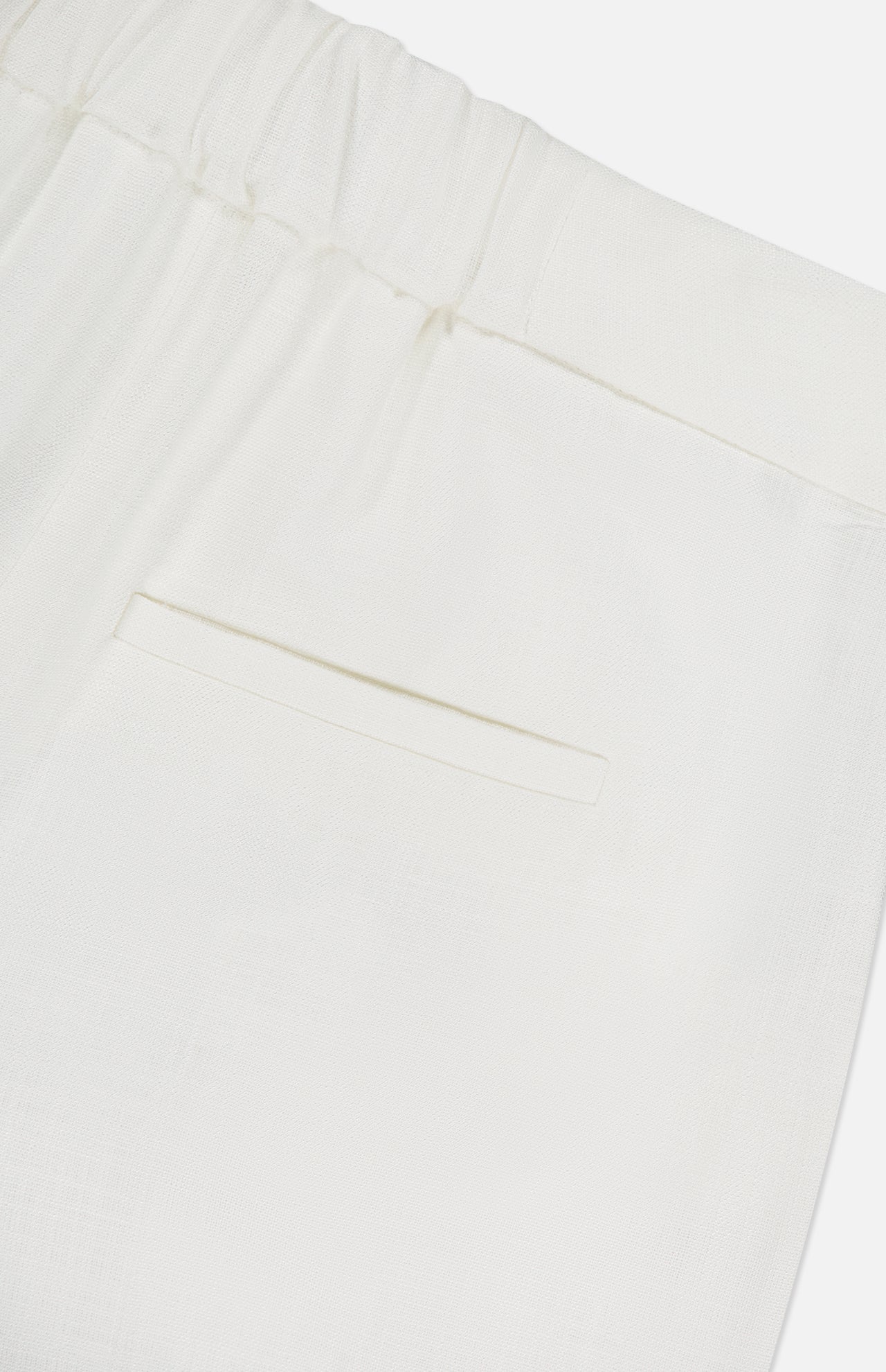 Close-up of the Marbeau Wide Leg Pant by VERONICA BEARD, showing the off-white high-rise design with an elastic waistband, single welt pocket, and lightweight textured fabric.
