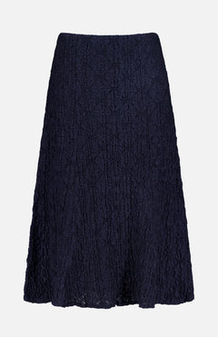 The VERONICA BEARD Massimo Stretch Midi Skirt features a navy, knee-length A-line cut in crinkled fabric—ideal for office to evening wear—shown on a plain white background.