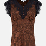 The Pascaline Floral Lace Top by VERONICA BEARD is a brown satin blouse showcasing a delicate floral motif, with short lace-trim sleeves, a flattering V-neckline, and decorative front buttons.