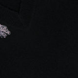 Veronica Beard Saelith Embellished Pullover Sweater in black, featuring a V-neck, stretch-wool blend, and floral beaded embroidery near the neckline.