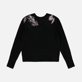 Veronica Beard Saelith Embellished Pullover Sweater in black stretch-wool blend, featuring pink and metallic floral beaded embroidery on the long-sleeved shoulders.
