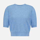 The Shana Cropped Cashmere Sweater by VERONICA BEARD is a light blue, short-sleeved, crew neck sweater featuring a relaxed fit with ribbed hem and cuffs, shown against a plain white background.