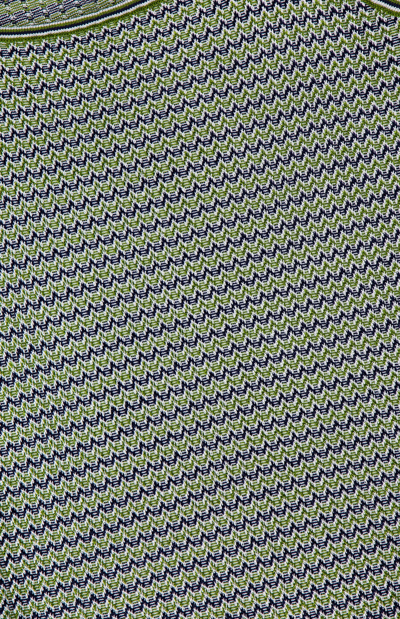 Close-up of a textured knit fabric with a green and black chevron pattern, showing a curved seam at the top—suggesting the neckline of the VERONICA BEARD Square Neck Sandra Knit Tank Top.