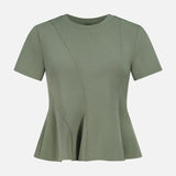 The Syverin Asymmetrical Paneling T-shirt by VERONICA BEARD features olive green stretch cotton, short sleeves, a round neck, decorative curved seams, and a peplum hem, shown against a plain white background.