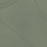 Close-up of the Syverin Asymmetrical Paneling T-shirt in olive green by VERONICA BEARD, size S/P, featuring visible stitched seams and a branded label at the collar.