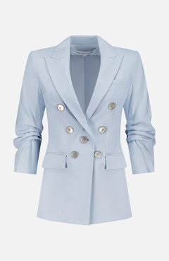 The Tomi Dickey Jacket by VERONICA BEARD is a pale blue Italian twill blazer, double-breasted with silver buttons, notched lapels, ruched long sleeves, two front flap pockets, dickey compatible, shown on a plain white background.