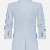 The Tomi Dickey Jacket by VERONICA BEARD is a pale blue Italian twill blazer with a notched collar, ruched sleeves, three decorative cuff buttons, and dickey compatibility for versatile styling.