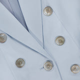 Close-up of the VERONICA BEARD Tomi Dickey Jacket in pale blue Italian twill, featuring six shiny silver buttons in two rows and part of the lapel; this blazer is also dickey compatible.