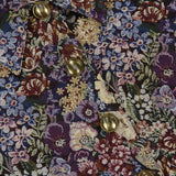 Close-up of a Veronica Beard Wilde Brocade Jacket with Removable Collar in slim fit floral brocade with a pointed collar and metallic gold buttons.