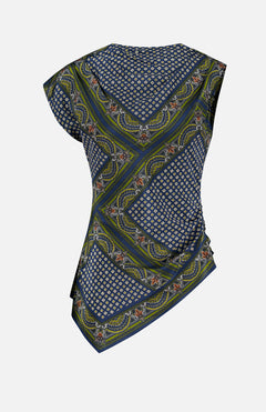 The Yvonne Scarf Print Top by VERONICA BEARD features asymmetrical short sleeves and a vibrant mix of blue, green, and yellow geometric and floral patterns. The draped fabric is ruched on one side for a distinctive gathered look. Shown from the back against a white background.
