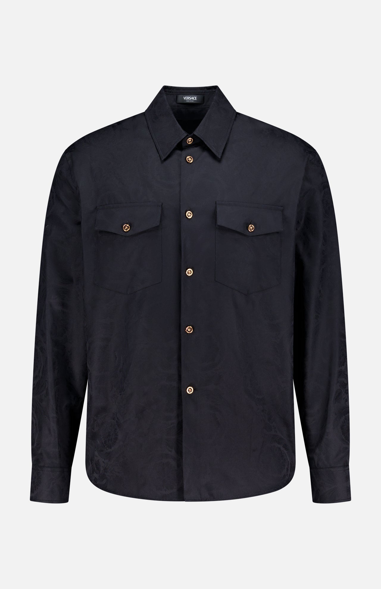 The VERSACE Baroque Jacquard Poplin Shirt features long sleeves, a black finish, two chest pockets, and signature Medusa buttons, shown against a plain white background.
