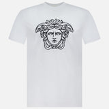 The VERSACE Cotton Jersey Medusa Embroidery T-Shirt showcases a black outlined Medusa head on the chest, set against a white background—a signature piece exemplifying luxury Italian fashion.