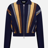 A luxury menswear piece by VERSACE, the Leather Patchwork Knit Jacket is a navy zip-up with collar, featuring bold geometric stripes in tan, brown, and gray—a modern wool-blend sweater-jacket style.