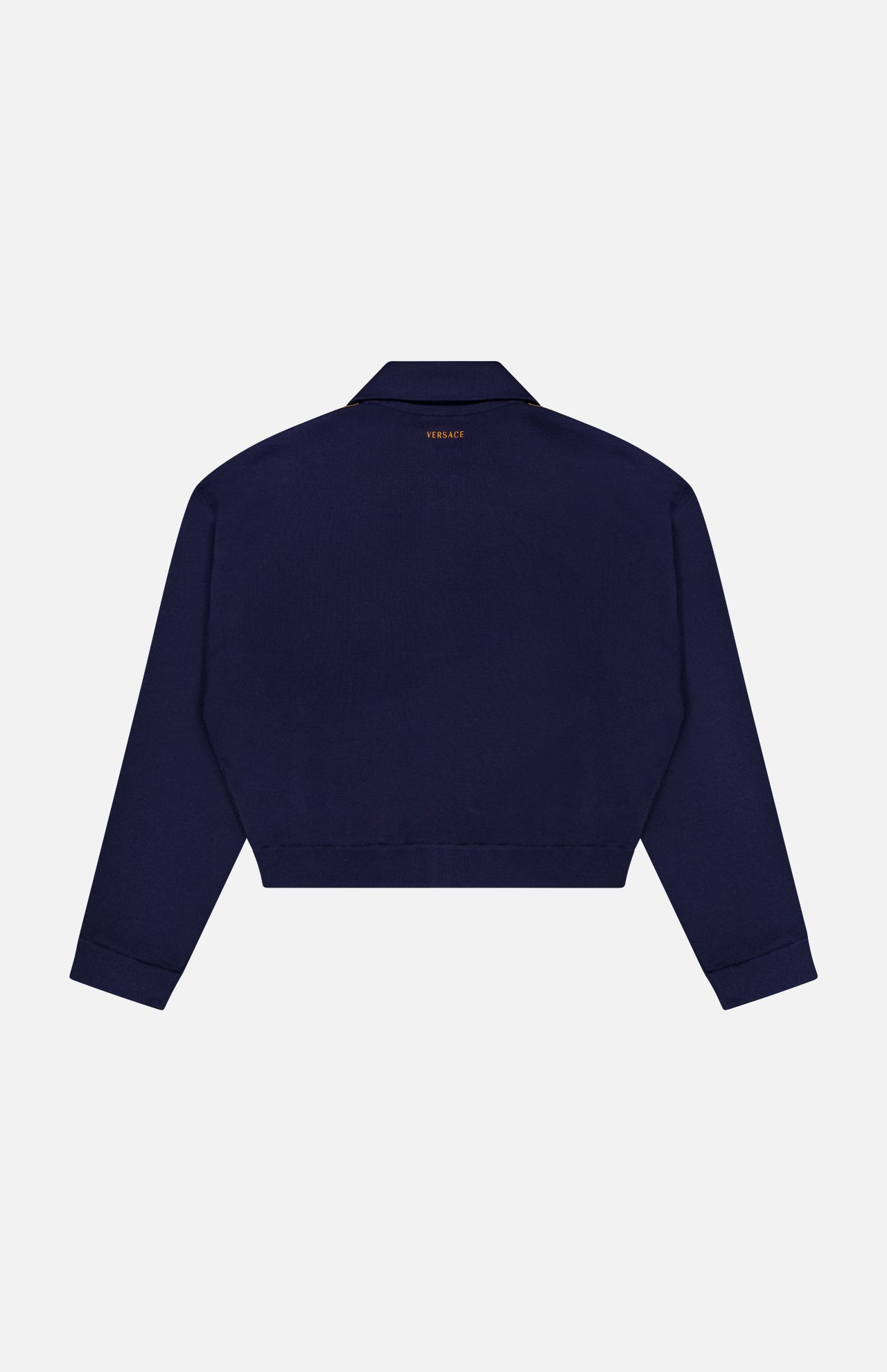 A Leather Patchwork Knit Jacket by VERSACE is shown from the back, featuring a small gold logo near the neckline. The jacket has a collar and straight hem, reflecting classic luxury Italian menswear style.