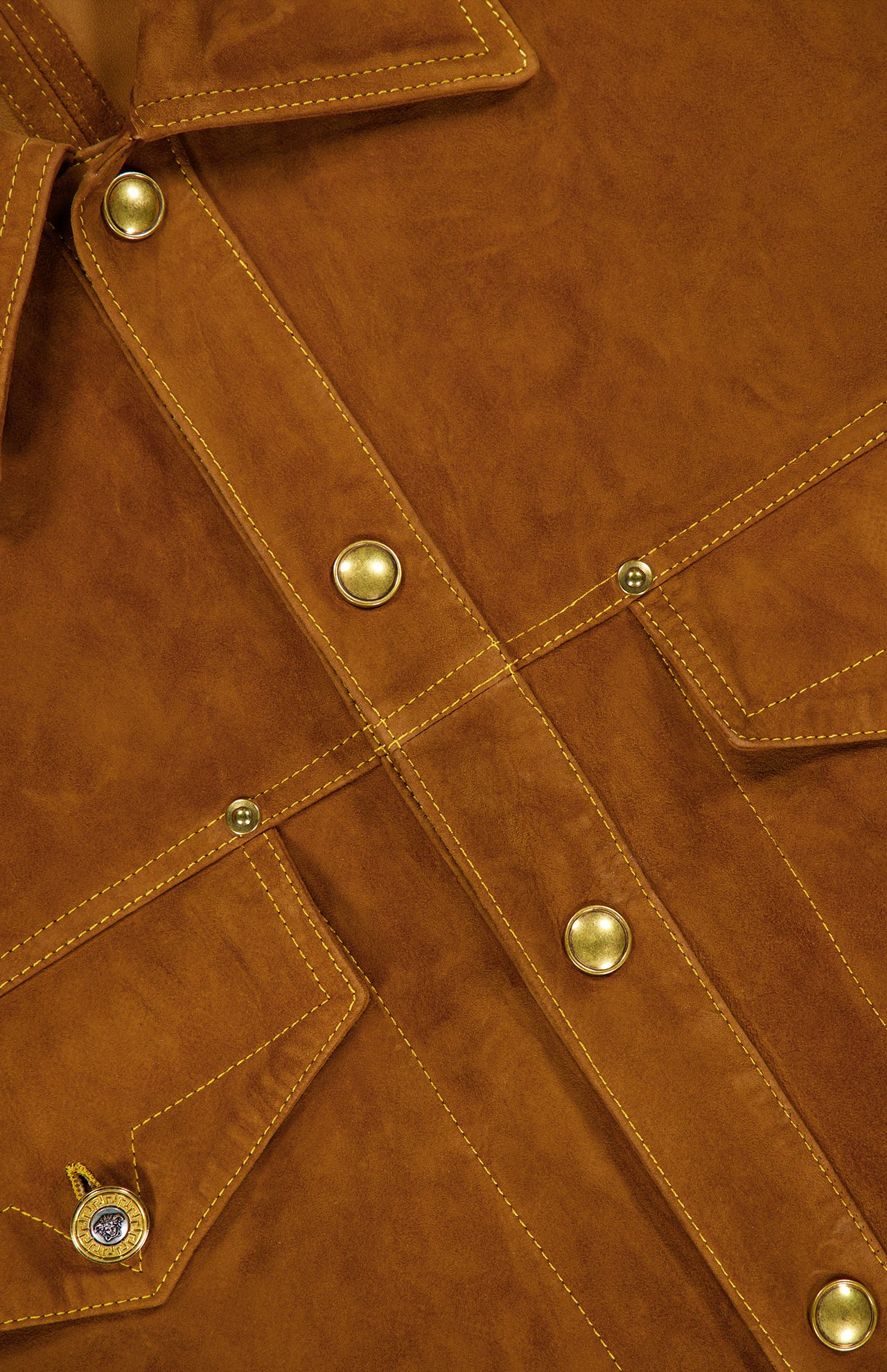 Close-up of the VERSACE Leather Suede Effect Jacket in brown, showcasing gold snap buttons, intricate stitching, and glimpses of two front pockets—an iconic piece of luxury Italian menswear.