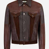 The VERSACE Leather Unit Mix Trucker Jacket is a men’s slim-fit piece crafted from brown leather and suede in varied shades, featuring a button-up front, pointed collar, flap chest pockets, and long sleeves for a polished look.