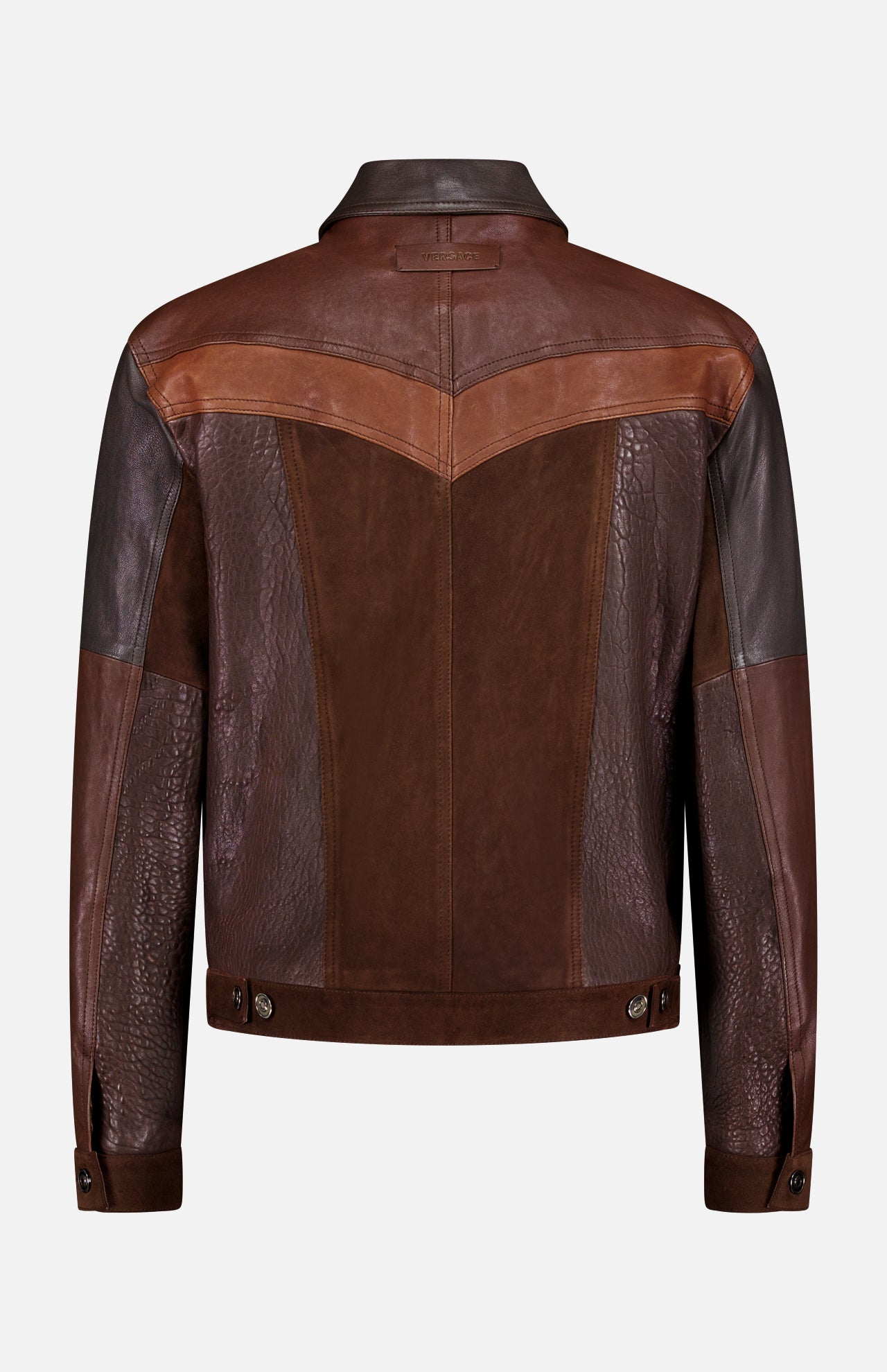 The VERSACE Leather Unit Mix Trucker Jacket, shown from the back, features panels of smooth, suede, and embossed crocodile textures with buttoned cuffs and waistband details, capturing the essence of a men's slim fit style.