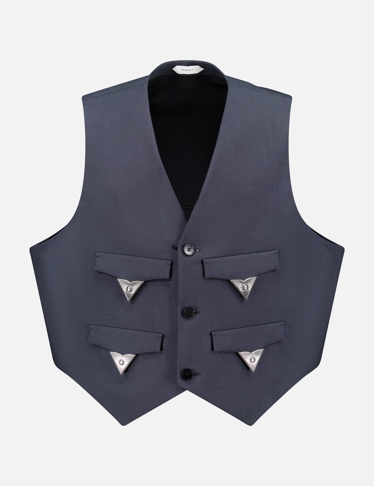 The VERSACE Light Weight Wool Mohair Vest features dark gray fabric, three black buttons, four front pockets with silver-trimmed triangular clasps, a sharp structured fit, and a deep V neckline for sophisticated Italian style.
