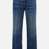 The VERSACE Non-Stretch Dirty Wash Jeans in Dirty Blue feature a straight-leg fit, button and zip closure, front and back pockets, visible leg seams, and a vintage-inspired faded finish.