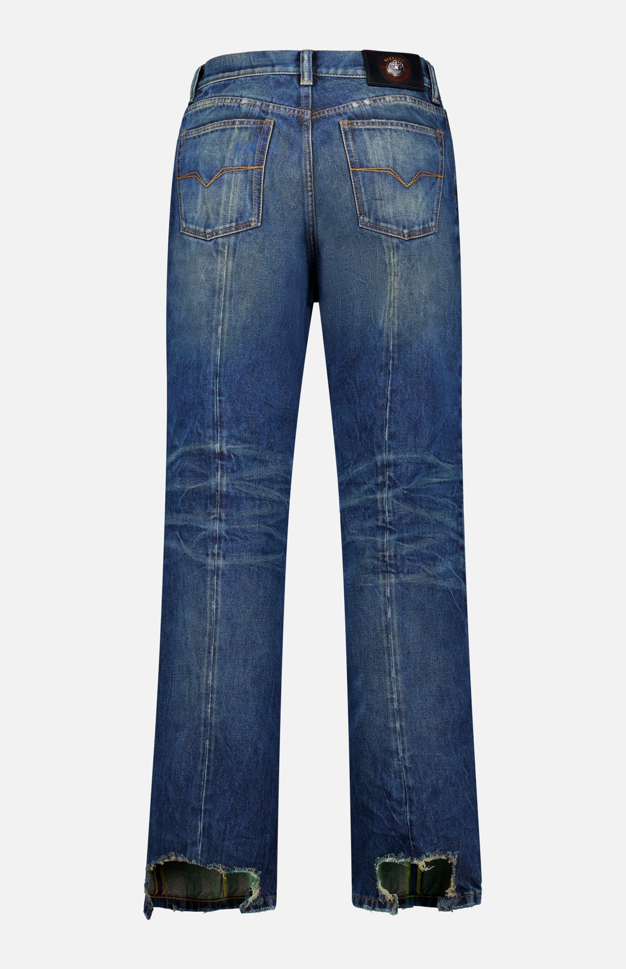 Back view of VERSACE Non-Stretch Dirty Wash Jeans in Dirty Blue with two back pockets, visible fading, crease details, frayed hems, and a black leather patch on the waistband.