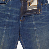 A pair of VERSACE Non-Stretch Dirty Wash Jeans in dirty blue, featuring visible stitching, faded detailing, a straight-leg cut, and a partially open zipper with button fly showing the waistband label and pocket lining.