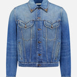 The VERSACE Rigid Stone Washed Denim Jacket features long sleeves, front button closure, Medusa hardware, two chest flap pockets, and side pockets in blue denim, shown against a plain white background.
