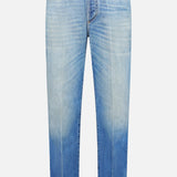 Versace Stone Washed Rigid Jeans for men in light blue feature a high waist, button and zipper closure, five pockets, and a unique faded wash that gradually shifts to a darker blue at the hem. Displayed front-facing on a white background, these straight-leg designer jeans offer both style and sophistication.