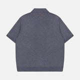 A back view of the VERSACE Sweater Rays Intarsia Knit Polo, a short-sleeved, collared dark gray wool-knit with a straight hem, showcased against a white background—a refined statement in luxury Italian menswear.