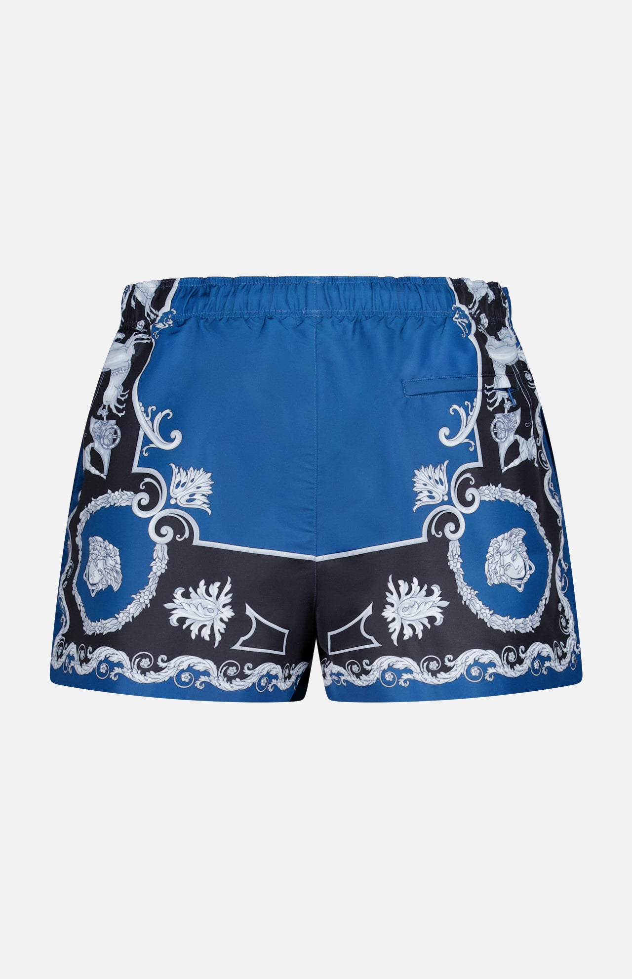 The Mythic Barocco Print Swim Shorts by VERSACE feature a blue and black design with a white baroque pattern, an elastic waistband, and a small right-side pocket, inspired by luxury Italian swimwear.