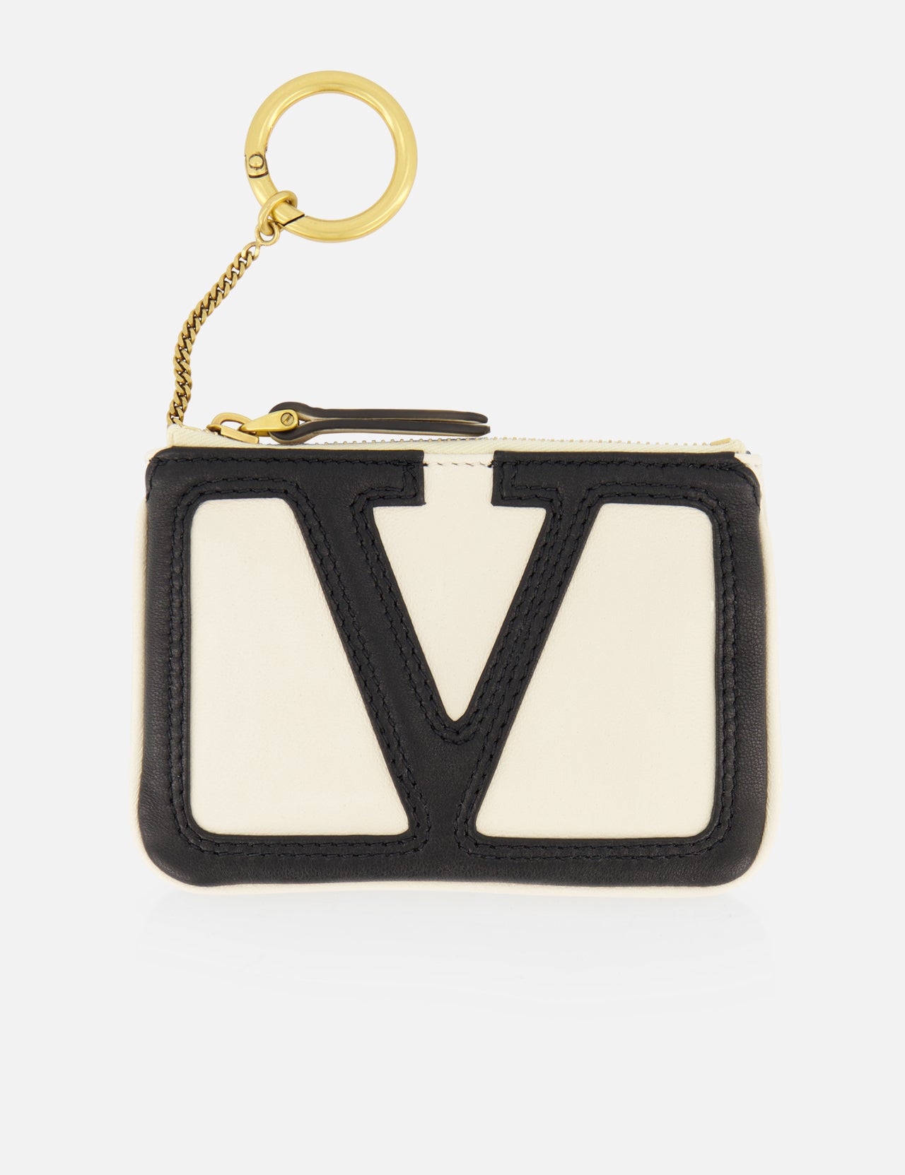 The VALENTINO GARAVANI Viva Superstar Key Bag is a small cream pouch with a bold black V on the front, finished with a gold zipper and an attached gold keyring on a short chain.