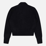 The WHITE + WARREN Cashmere Gold Button Polo Top is shown flat, back facing up. This black, long-sleeved knit features ribbed cuffs, waistband, and collar in a cropped style.