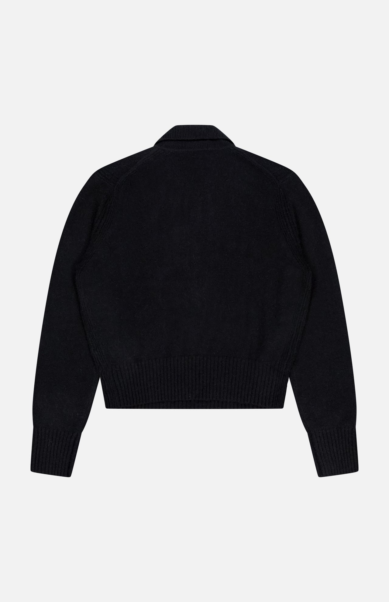 The WHITE + WARREN Cashmere Gold Button Polo Top is shown flat, back facing up. This black, long-sleeved knit features ribbed cuffs, waistband, and collar in a cropped style.