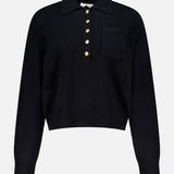 The WHITE + WARREN Cashmere Gold Button Polo Top is a black long-sleeve sweater with a collar, front pocket, five gold buttons on the placket, and ribbed cuffs and hem for a polished finish.